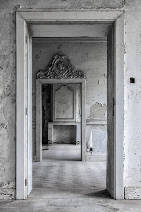 a-see-through-white-doors-in-an-abandoned-castle.jpg