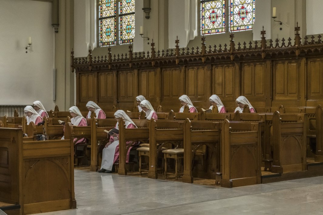 Nuns praying in a church.jpg